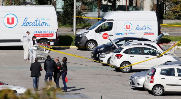 A general view shows police officers and investigators at a supermarket after a hostage situation in Trebes, France, March 23, 2018. (Reuters/Regis Duvignau)