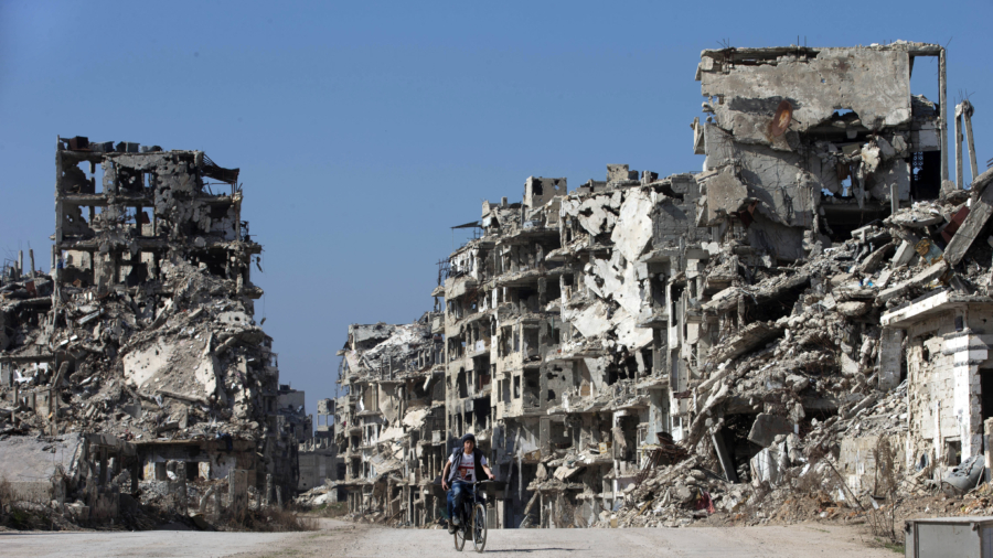 Syria: opposition fighters to leave last rebel-held neighborhood in Homs