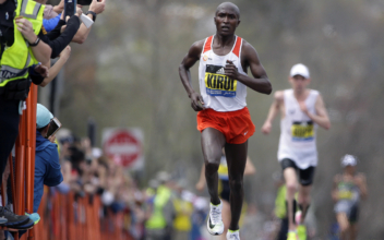 Kenyan man, woman win Boston Marathon