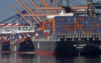 Drop in cell phone imports cuts February trade deficit almost ten percent