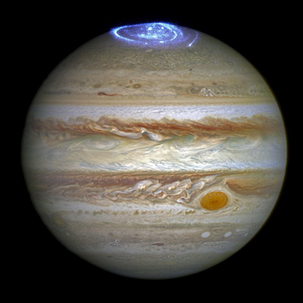 This composite image provided by NASA on Thursday, June 30, 2016 shows auroras on the planet Jupiter. (NASA/ESA/Hubble via AP)