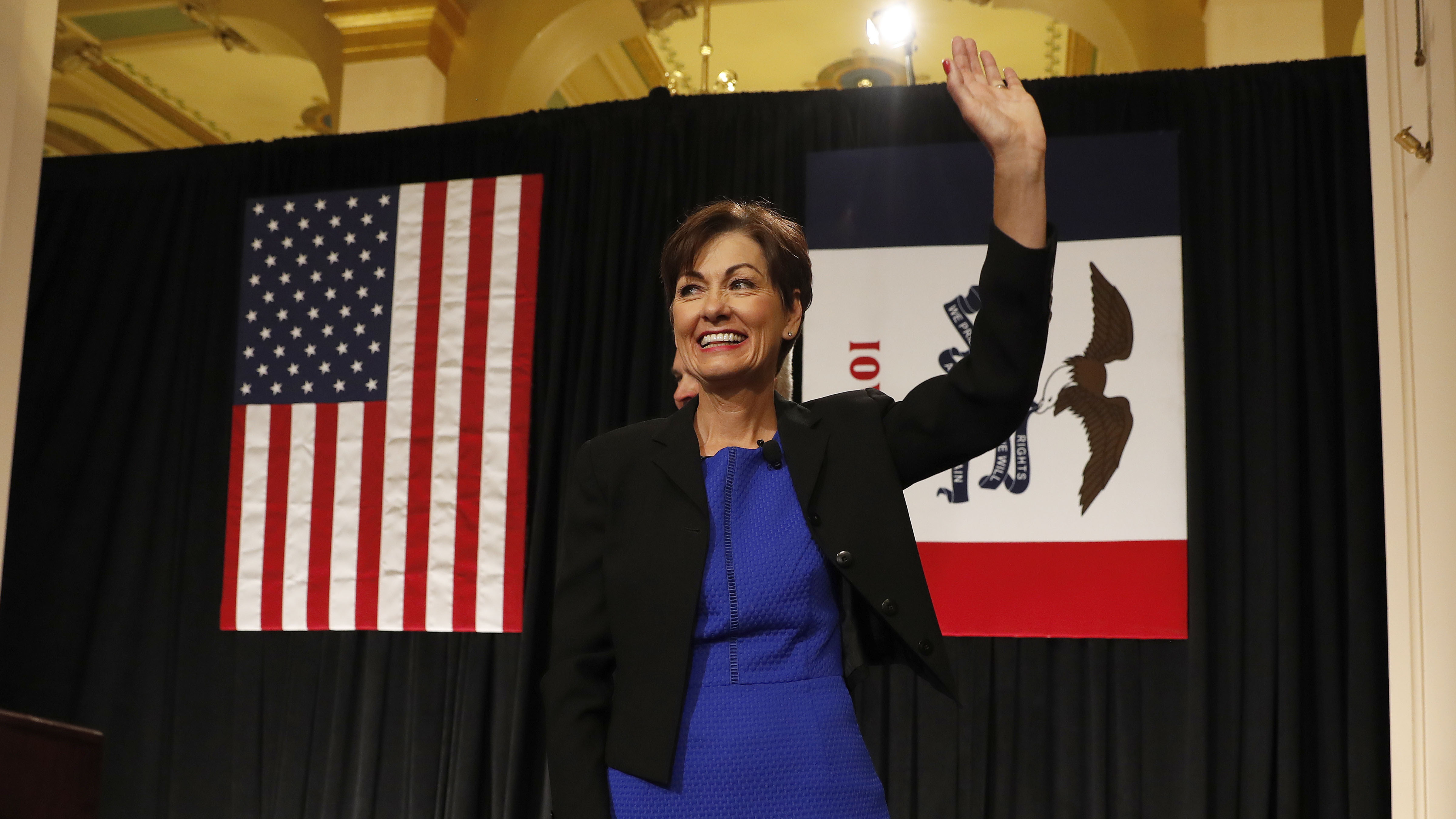 Iowa Gov. Kim Reynolds waves after speaking during a ceremonial swearing in at the Statehouse in Des Moines, Iowa on May 24, 2017. (AP Photo/Charlie Neibergall)