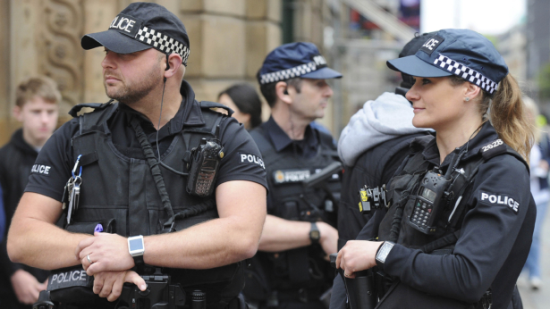 Armed response police stand at the start of the Great Manchester Run in central Manchester, United Kingdom, on May 28 2017. (Rui Vieira/AP)