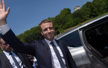 France’s President Macron choosing new cabinet after big Parliamentary election win