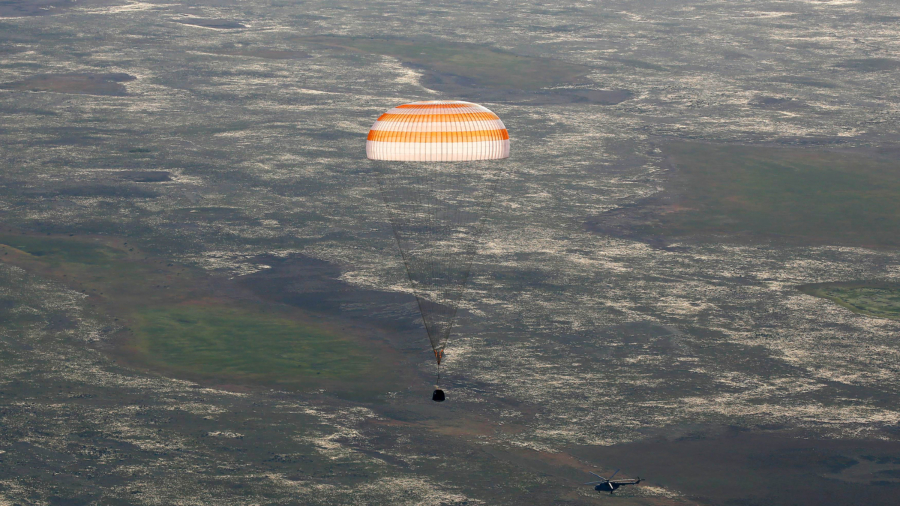 Two astronauts return to Earth from ISS