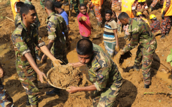 140 killed by Bangladesh mudslide; rescuers dig for survivors