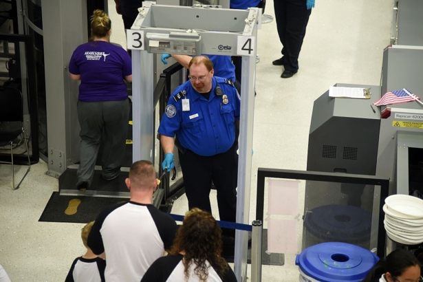 US Transportation Security Administration (TSA) officers inspect airline passengers before they board their flights, at LambertSt. Louis International Airport in St Louis, Missouri, on Oct. 10, 2016. (Robyn Beck/AFP/Getty Images)