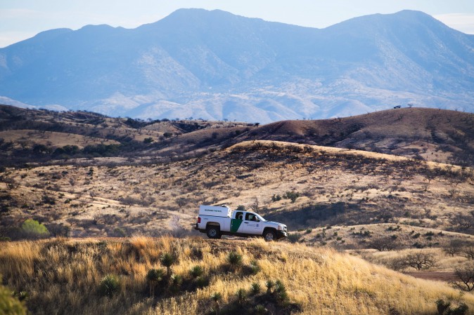 A U.S. Border Patrol agent parks on a hill top near the border fence in Nogales, Arizona, on Feb. 17, 2017, on the US/Mexico border. (Jim Watson/AFP/Getty Images)