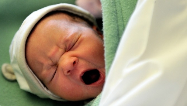 A newborn yawns at a maternity ward in a file photo. (Philippe Huguen/AFP/Getty Images)
