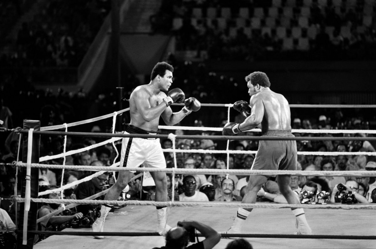 Former world heavyweight champion Muhammad Ali (L) and U.S. titleholder George Foreman fight during their world heavyweight championship match in Kinshasa, Zaire, on Oct. 30, 1974. Ali won by knocking out Foreman in the eighth round. (AFP/Getty Images)