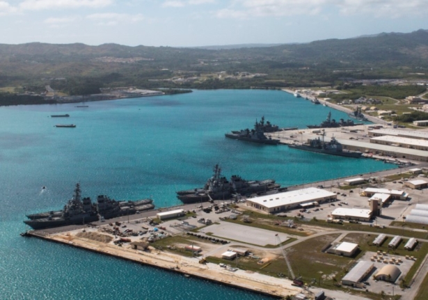 Navy vessels are moored in port at the U.S. Naval Base Guam at Apra Harbor