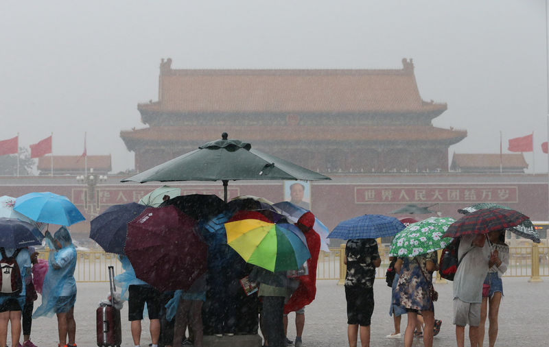 Storms disrupt Beijing flights, authorities warn of flash floods, landslides