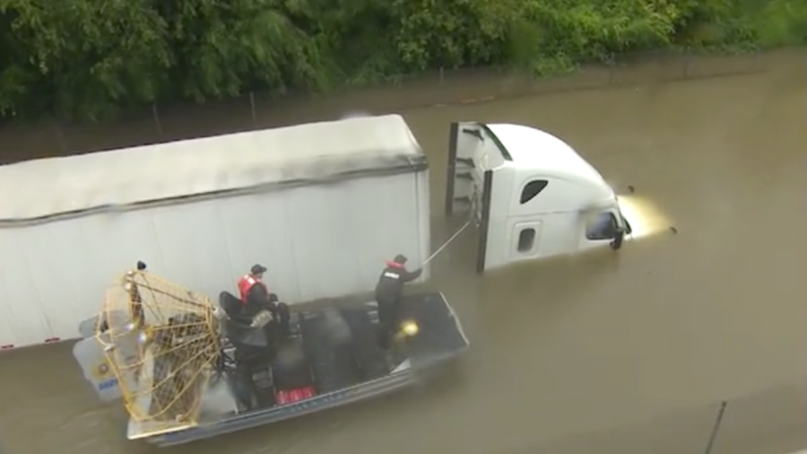 Truck Driver Rescued, Texans Looking Out For Each Other As Flood Waters Continue To Rise
