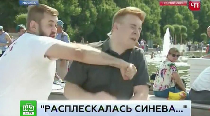 Russian reporter punched on live TV