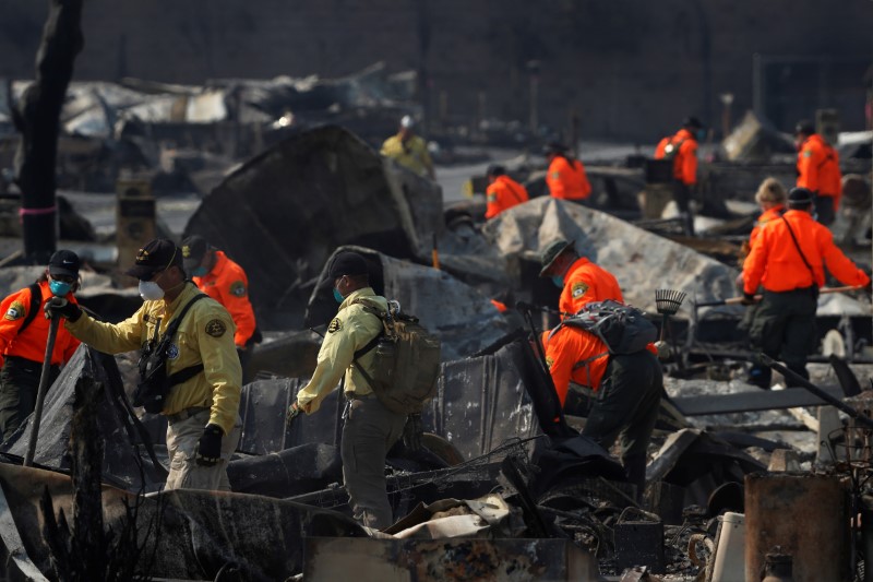 Search and Rescue teams search for two missing people amongst ruins at Journey's End Mobile Home Park destroyed by the Tubbs Fire in Santa Rosa, Calif., on Oct. 15, 2017. (REUTERS/Stephen Lam)