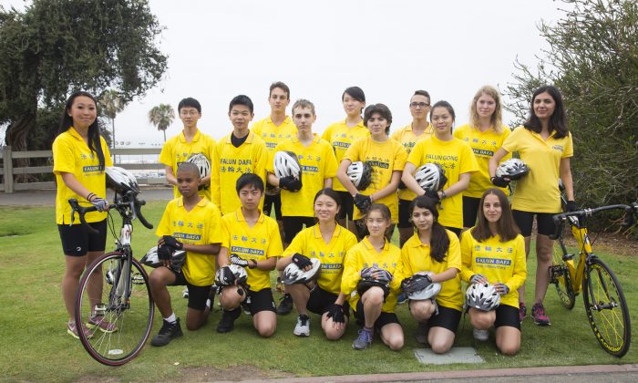 “Youth Ambassadors” from more than 10 countries pose for a photo before a rally Sunday, May 31, 2015. They are cyclists for Ride to Freedom, a group of 30 young people who will bike from Los Angeles to Washington, D.C., and finally New York on a 3,000-mile trip to ultimately rescue five orphans in China whose parents were killed because of their beliefs.