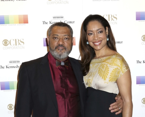In this Dec. 6, 2015 file photo, Laurence Fishburne, left, and Gina Torres attend the 38th Annual Kennedy Center Honors at The Kennedy Center Hall of States in Washington. (Photo by Greg Allen/Invision/AP, File)
