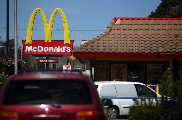 Customers wait in a drive-through line at a McDonald's restaurant on March 12, 2013, in Mill Valley, California. (Justin Sullivan/Getty Images)