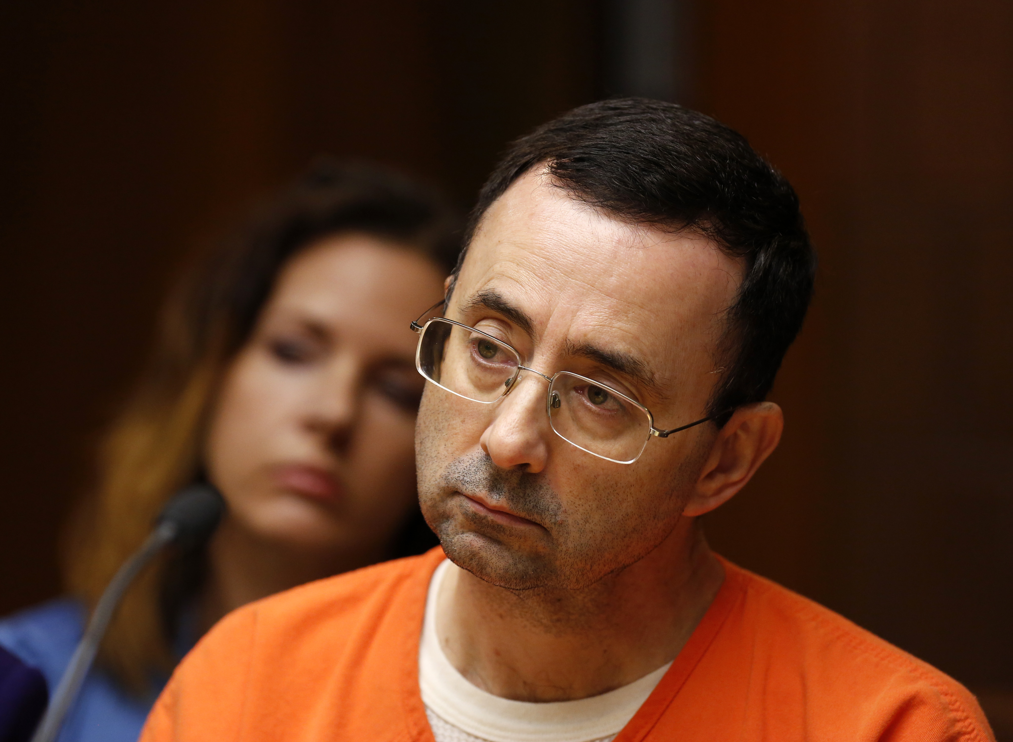 Former Michigan State University and USA Gymnastics doctor Larry Nassar is seen in the 55th District Court where Judge Donald Allen Jr. bound him over on June 23, 2017, in Mason, Michigan to stand trial on 12 counts of first-degree criminal sexual conduct. (JEFF KOWALSKY/AFP/Getty Images)