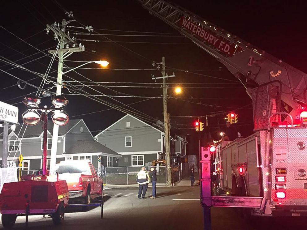 Waterbury Police and Firemen clean up the scene where a driver fleeing police was involved in a vehicle collision that killed a three-year-old on Nov. 21, 2017. (Connecticut State Police)