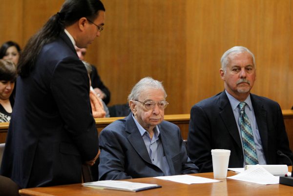 Former priest John Feit listens to his attorney O. Rene Flores (L), as he decides not to testify during the sentencing phase of his trial at the Hidalgo County Courthouse in Edinburg, Texas, U.S., December 8, 2017. (Reuters/Nathan Lambrecht/The Monitor/Pool)