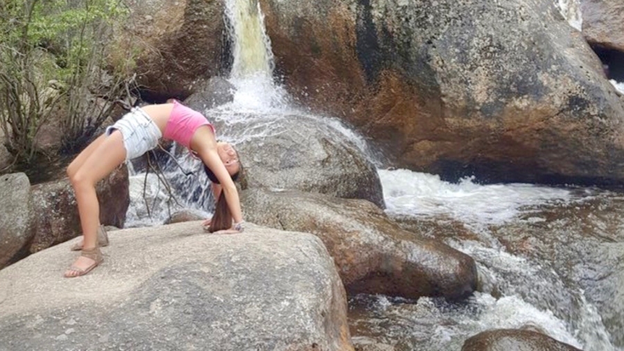 Woman Attempting Yoga Pose Alone on Mountain Pass Falls Into River