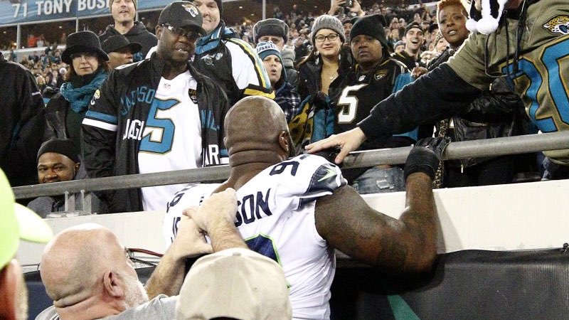 Seahawks Player Attempts to Climb Stands After Fan Throws Drink