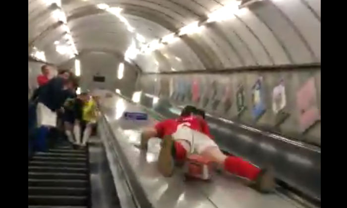 Man’s Stunt Backfires as He Slides Down an Escalator