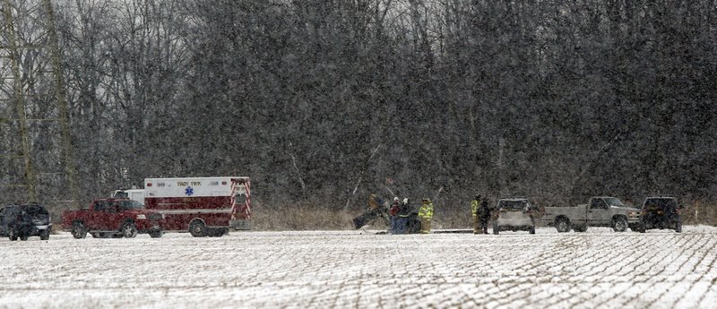 Police and emergency crews respond to a fatal helicopter crash in a field near State Rt. 163 and Pemberville Road in Troy Township, Wood County, Ohio, on Jan. 15, 2018. (Amy E. Voigt/The Blade via AP)