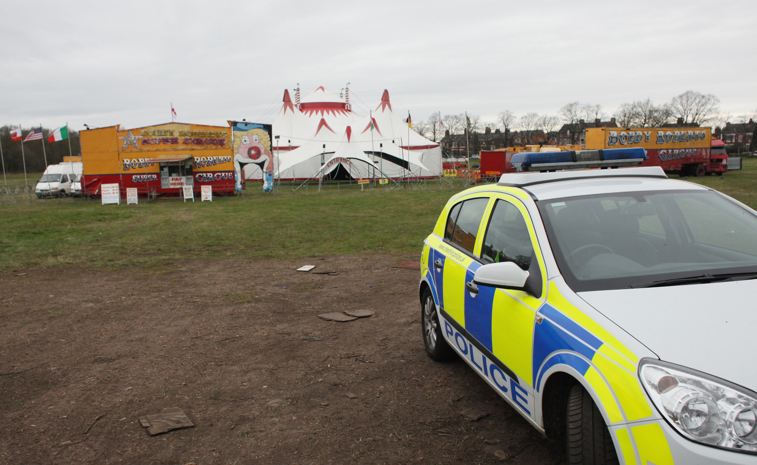 A police car parks at the entrance to Bobby Roberts Circus on Knutsford Common in Knutsford, England, on March 30, 2011. Bobby Roberts Circus has had to erect a security fence around its giant tent for the first time in its history in the wake of a video showing Anne, one of its retired elephants, being abused. (Christopher Furlong/Getty Images)