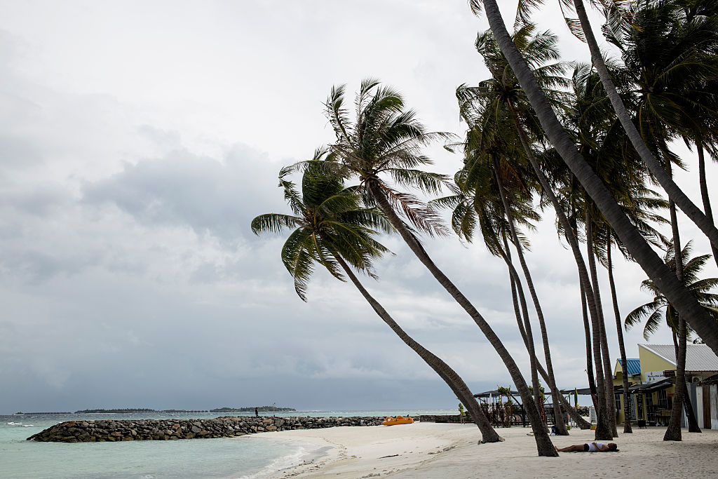 A beach with rain on the horizon in Maafushi, Maldives, on Nov. 1, 2016. (Aishath Adam/Getty Images)