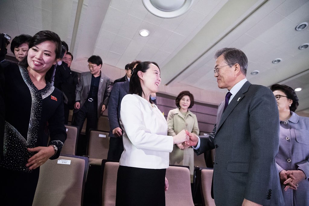 South Korean President Moon Jae-in (R) shakes hands with Kim Yo Jong (C), North Korean leader Kim Jong Un's sister, during a performance of North Korea's Samjiyon Orchestra at National Theater in Seoul, South Korea, on Feb. 11, 2018. (South Korean Presidential Blue House via Getty Images)