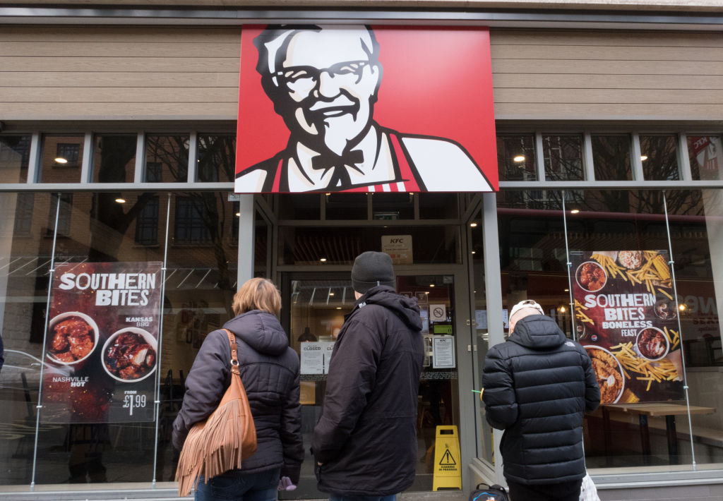 People look into a branch of KFC that is closed due to problems with the delivery of chicken in Bristol, England on Feb. 20, 2018. (Matt Cardy/Getty Images)