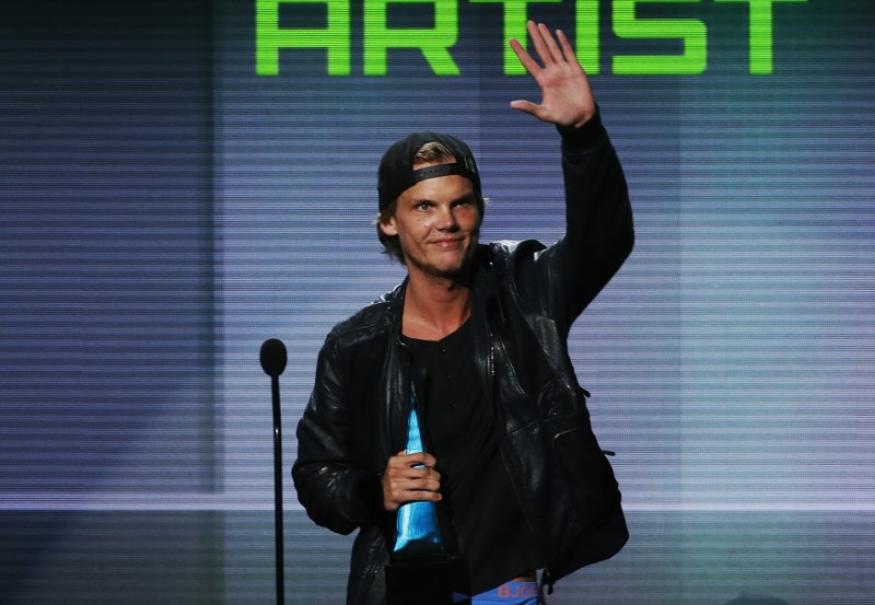 Avicii accepts the favorite electronic dance music artist award at the 41st American Music Awards in Los Angeles, Calif., on Nov. 24, 2013. (Lucy Nicholson/Reuters)