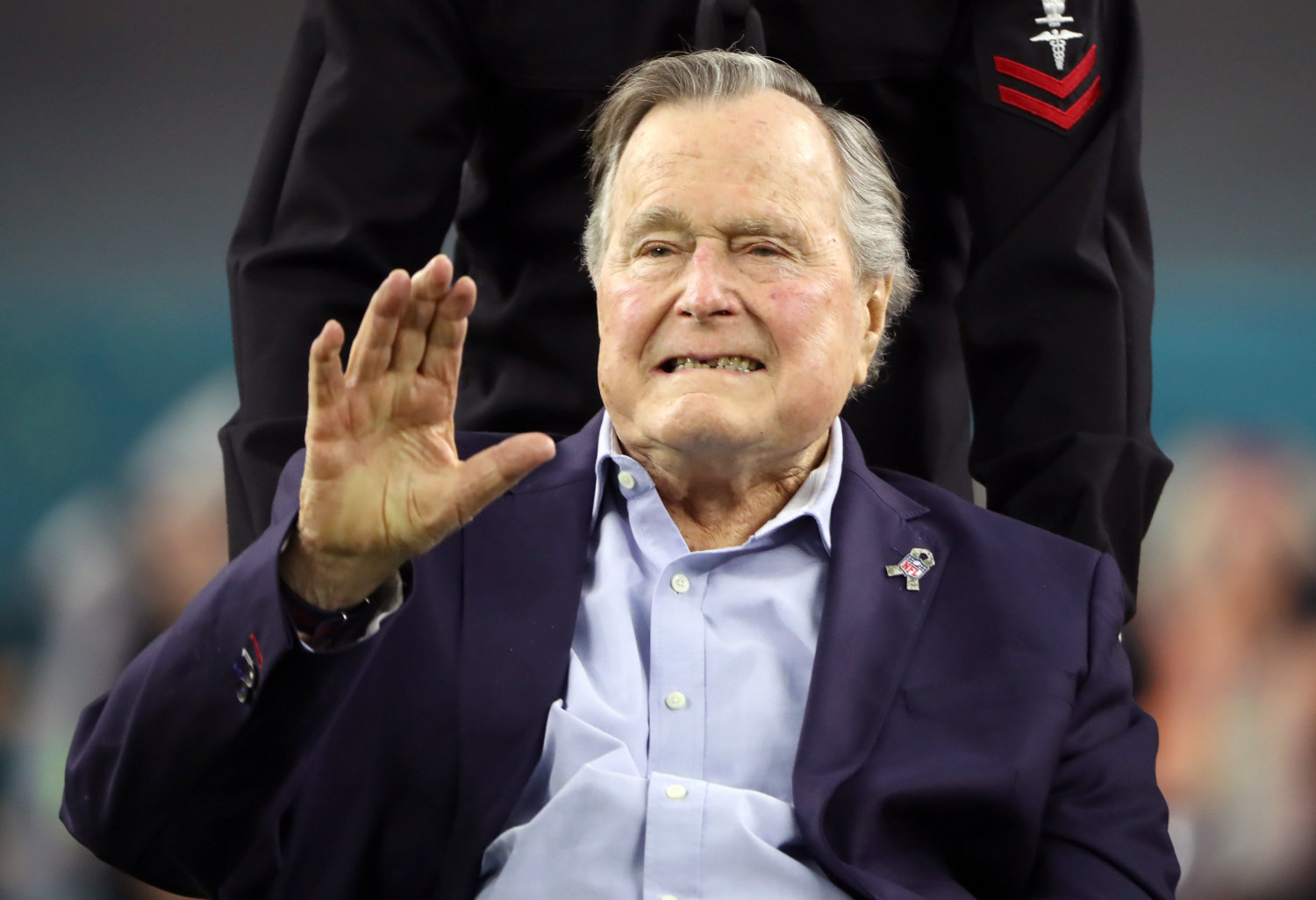Former President George H.W. Bush arrives on the field to do the coin toss ahead of the start of Super Bowl LI between the New England Patriots and the Atlanta Falcons in Houston, Texas on Feb. 5, 2017. (Adrees Latif/Reuters File Photo)