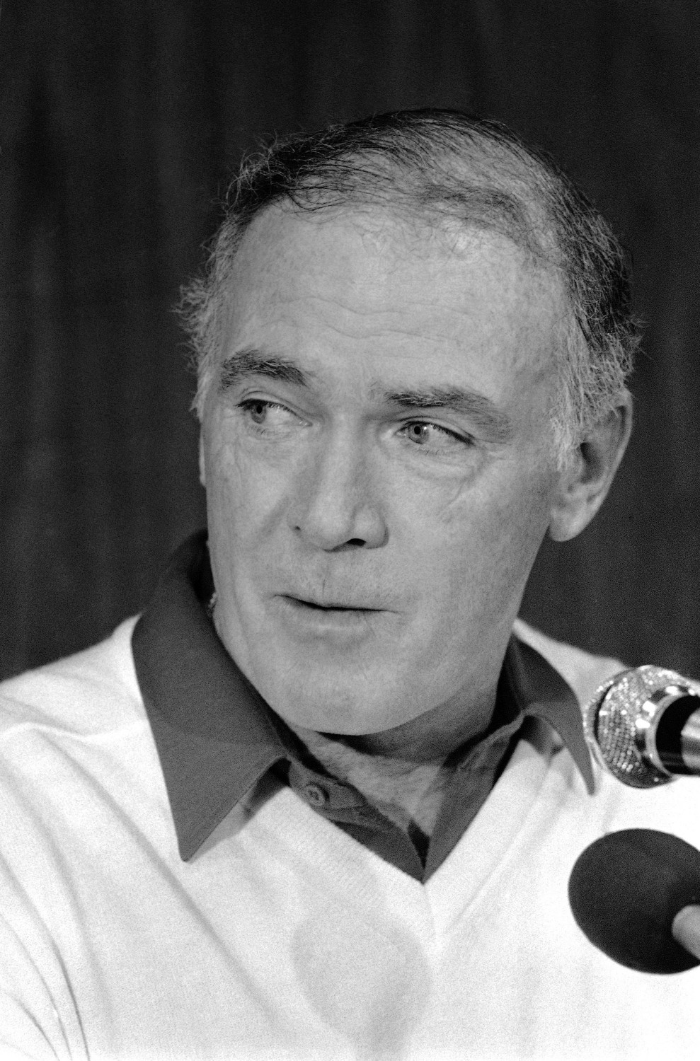 Seattle Seahawks coach Chuck Knox listening during a news conference in Miami on Dec. 31, 1983. (AP Photo/Kathy Willens, file)