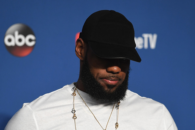 LeBron James looks downcast as he discusses his futures with the media after being defeated by the Golden State Warriors during Game Four of the 2018 NBA Finals on June 8, 2018. (Jason Miller/Getty Images)