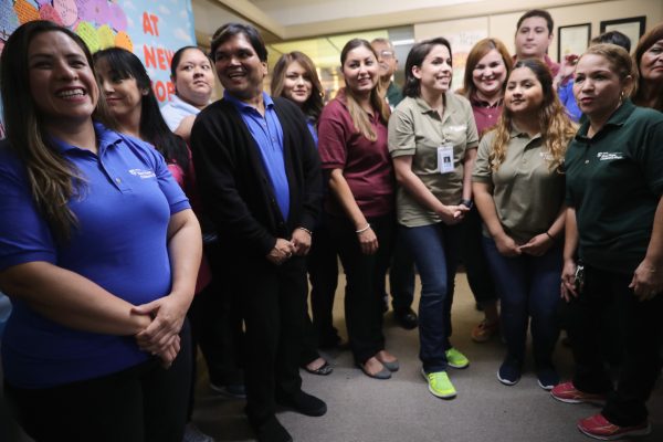 Workers look on as First Lady Melania Trump (not pictured) walks through the Upbring New Hope Children's in McAllen, Texas, on June 21, 2018. (Chip Somodevilla/Getty Images)