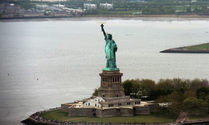 Woman Climbs Statue of Liberty on July 4