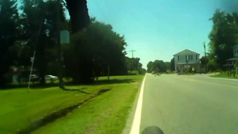 Video Shows Speeding Car Swerve into Yard to Avoid Cyclist