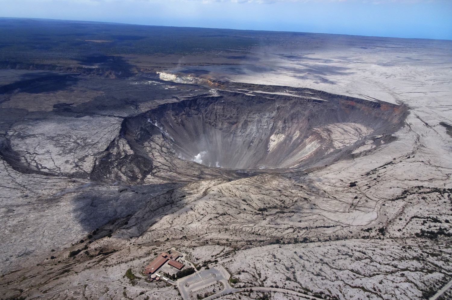 USGS scientists captured this aerial photo of Halema‘uma‘u and part of the Kilauea caldera floor during a helicopter overflight of Kīlauea's summit on July 14, 2018. (USGS).