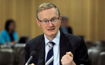 Australia Central Bank Governor Signals Lower for Longer Rates