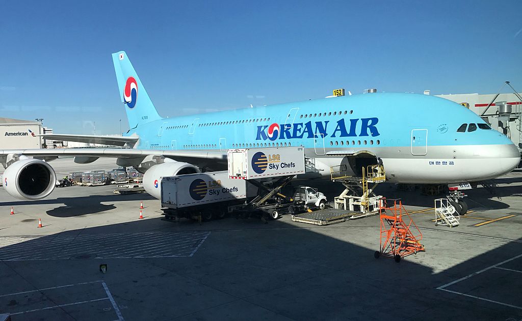 An airplane (C) carrying South Korean citizens repatriated from the Chinese city of Wuhan lands at Gimpo airport in Seoul on Jan. 31, 2020. (JUNG YEON-JE/AFP via Getty Images)