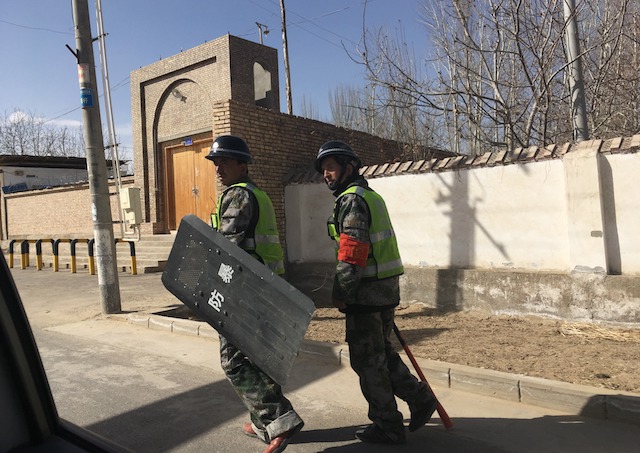 Local police patroling a village in Hotan prefecture, in China's western Xinjiang region, on Feb. 17, 2018 (BEN DOOLEY/AFP/Getty Images)