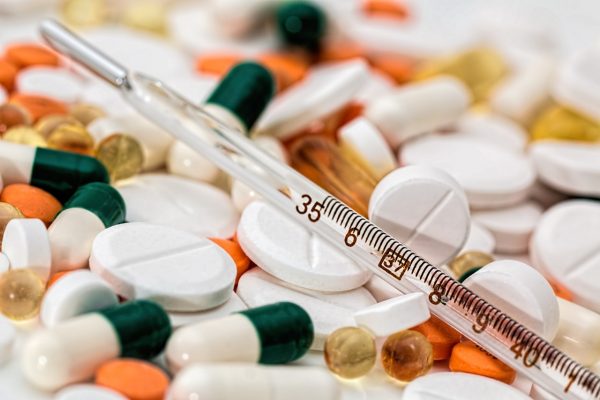 A thermometer with various medications. (Pixabay/Pexels)