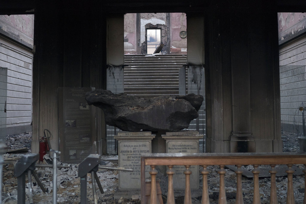 A meteorite on exhibit is seen inside the entrance of the National Museum after an overnight fire in Rio de Janeiro, Brazil, on Sept. 3, 2018. (Leo Correa/AP)