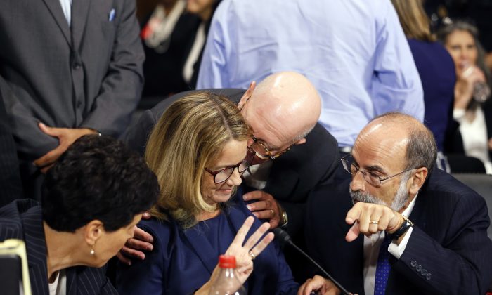 Christine Blasey Ford (C) and her attorneys Debra Katz (L) and Michael Bromwich at the Senate Judiciary Committee hearing on the nomination of Brett Kavanaugh to be an associate justice of the Supreme Court of the United States on Capitol Hill on Sept. 27, 2018. (Michael Reynolds-Pool/Getty Images)