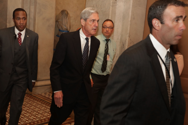 Special counsel Robert Mueller (C) is surrounded by security and staff as he leaves a meeting with senators at the U.S. Capitol in Washington, on June 21, 2017. (Chip Somodevilla/Getty Images)