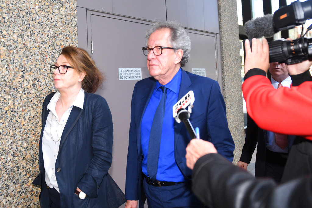 Australian actor Geoffrey Rush, center, leaves the Federal Court in Sydney, Australia on Oct. 22, 2018. (Dean Lewins/AAP Image via AP)