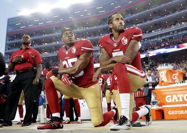 First NFL Cheerleader Kneels During National Anthem